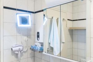 a shower with a glass door in a bathroom at Apart-2-OG-Nr2 in Darmstadt