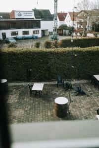 a view of a patio with a table and benches at Astheimer Schlösschen in Trebur