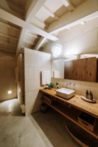 a bathroom with a sink and a mirror at Agroturismo Rafal Rubí in Alaior +26 photos