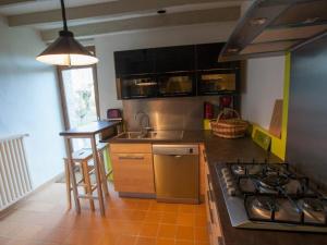a kitchen with a stove and a counter top at Séjour nature au cœur du Parc de la Brenne: gîte 4 chambres, jardin et terrasse, proche de Rosnay - FR-1-591-141 in Rosnay