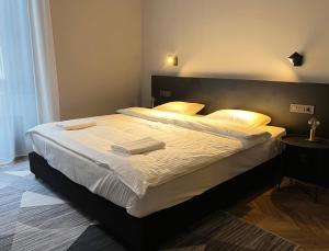 Posteľ alebo postele v izbe v ubytovaní Hotel Rumor