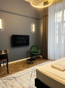 Posteľ alebo postele v izbe v ubytovaní Hotel Rumor