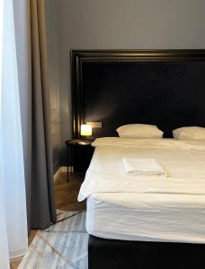 Posteľ alebo postele v izbe v ubytovaní Hotel Rumor