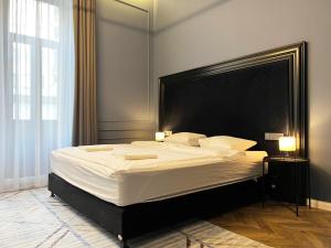 Posteľ alebo postele v izbe v ubytovaní Hotel Rumor