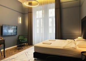 Posteľ alebo postele v izbe v ubytovaní Hotel Rumor