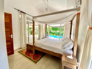 Tempat tidur dalam kamar di Saffron Villas