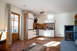 Kuchyň nebo kuchyňský kout v ubytování Landhaus Lodges Kaprun by we rent