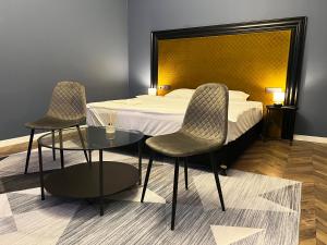 Posteľ alebo postele v izbe v ubytovaní Hotel Rumor