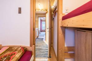 a hallway of a tiny house with a bunk bed at Hochfügenblick-erholung für Zwei in Hochfugen