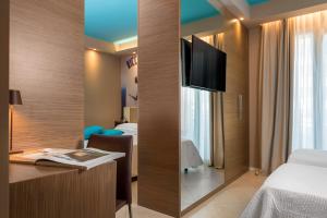 Postel nebo postele na pokoji v ubytování Hotel Adlon - FRONTE MARE