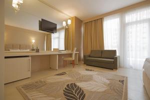 TV a/nebo společenská místnost v ubytování Horizont Hotel
