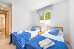 Postel nebo postele na pokoji v ubytování Apartment Es Mirador 2