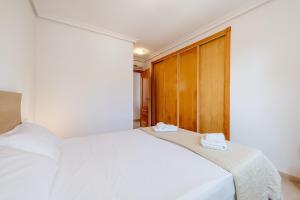 Postel nebo postele na pokoji v ubytování Apartment Es Mirador 2