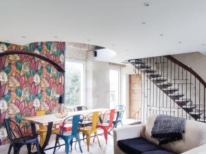 a dining room with a table and chairs at Gîte d'Architecte 6 Pers. avec Terrasse et Jardin à Pissotte - FR-1-426-480 in Pissotte +22 photos