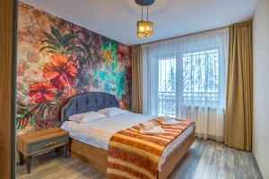 Krevet ili kreveti u jedinici u okviru objekta Colors of Nature in Stylish Flat in Pamporovo