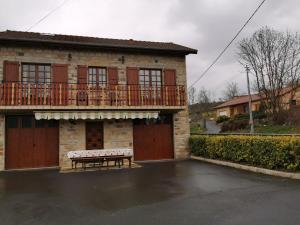 a house with a bench in front of it at Gîte Saint-Germain-Laprade, 4 pièces, 6 personnes - FR-1-582-322 in Saint-Germain-Laprade