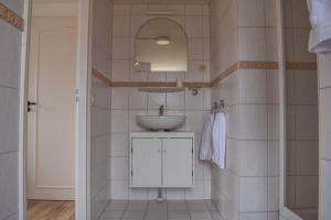 Ванная комната в De Welvaart - Logement +22 фотографии