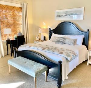 a bedroom with a large bed and a desk at 30A! Redfish Village Unit M2-424 is in the heart of it all!! in Santa Rosa Beach