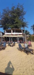 a shadow of a person on the beach at Drishti yoga international in Patnem