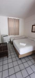 Ein Bett oder Betten in einem Zimmer der Unterkunft Pousada Temporada Atlântica