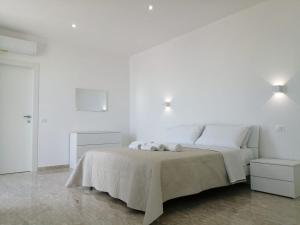 Letto o letti in una camera di AMARE Bed & Breakfast