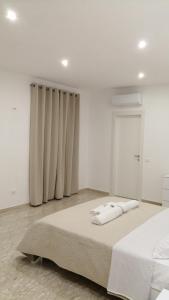 Letto o letti in una camera di AMARE Bed & Breakfast