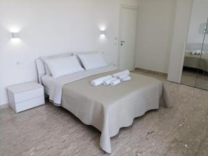 Letto o letti in una camera di AMARE Bed & Breakfast
