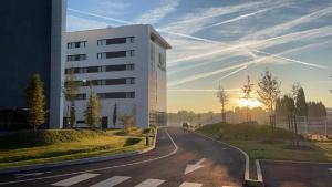 a building on the side of a road at Holiday Inn Paris CDG Airport an IHG Hotel in Roissy-en-France