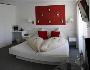 Postel nebo postele na pokoji v ubytování Hotel-Garni Fels