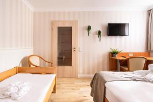 
Ein Bett oder Betten in einem Zimmer der Unterkunft Cityhotel Bernburg
