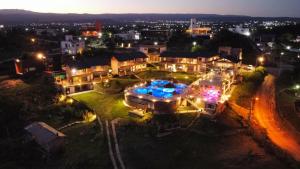 an aerial view of a city at night at ERNESTINA VILLAGE Resort Apart & suites in Villa Carlos Paz