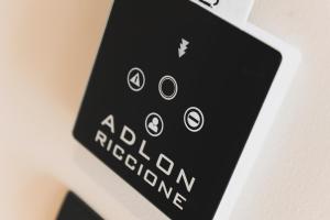 a close up of a remote control on a appliance at Hotel Adlon - FRONTE MARE in Riccione