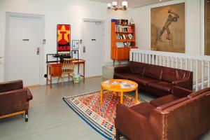a living room with a couch and a table at City Backpackers Hostel in Stockholm