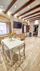 a living room with a white table and chairs at Borro Palace in Cagliari