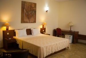 Postel nebo postele na pokoji v ubytování Hôtel Marbella