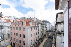 a view of a city street with buildings at Dockside Apartment by Innkeeper in Lisbon