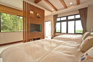 Voodi või voodid majutusasutuse Li Wu Zuo Cun B&B toas