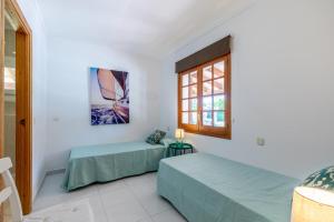 Posteľ alebo postele v izbe v ubytovaní Villa Vora Puerto Pollensa by JS Villas