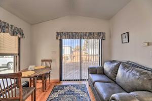 a living room with a couch and a table at Cozy Cottage with Shared Dock on Dawson Creek in Oriental