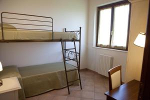 Postel nebo postele na pokoji v ubytování Residence Colle Veroni + 37 fotografií