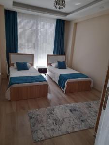 Voodi või voodid majutusasutuse Çınar Residance toas