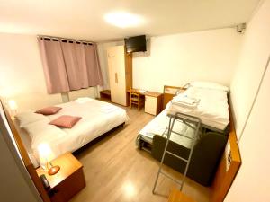 Rúm í herbergi á Hotel B&B Lorenzini Ski