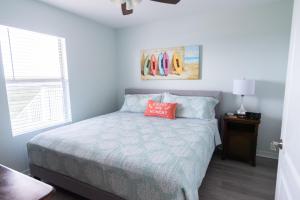 Grand Beach Resort Penthouse 1客房内的一张或多张床位