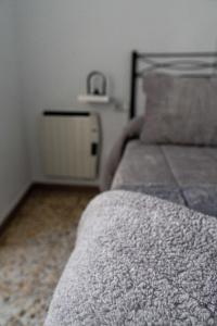 Łóżko lub łóżka w pokoju w obiekcie Casa Villanueva de Córdoba