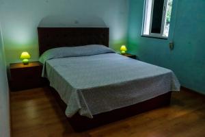 מיטה או מיטות בחדר ב-Casa Sams