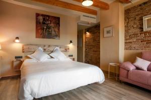 Ein Bett oder Betten in einem Zimmer der Unterkunft Priorat Aparthotel