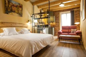 Ein Bett oder Betten in einem Zimmer der Unterkunft Priorat Aparthotel