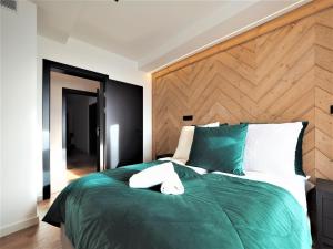 Posteľ alebo postele v izbe v ubytovaní VIP Apartamenty Gorące Źródła