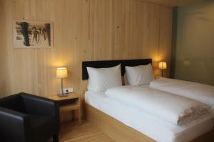 Voodi või voodid majutusasutuse Hotel am Garnmarkt toas