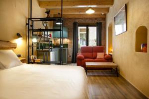 Ein Bett oder Betten in einem Zimmer der Unterkunft Priorat Aparthotel